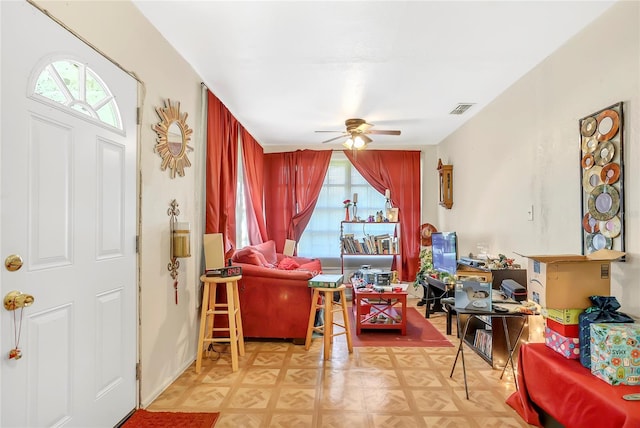 living room with light parquet floors and ceiling fan