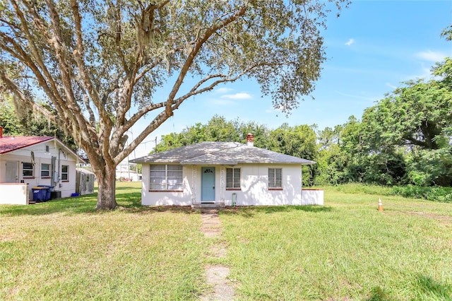 view of front of home with a front yard