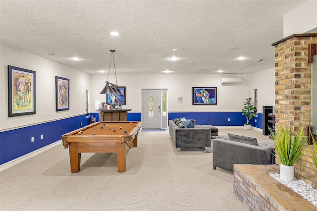 recreation room featuring light colored carpet, pool table, a textured ceiling, and an AC wall unit