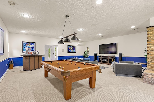 recreation room featuring light carpet, pool table, and a textured ceiling