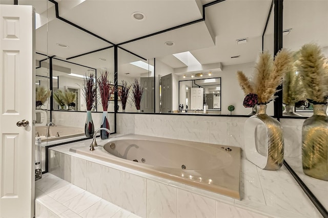 bathroom with tiled tub