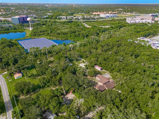 birds eye view of property featuring a water view