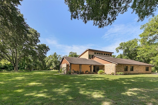 view of property exterior with a lawn