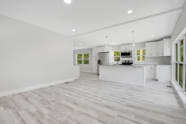 unfurnished living room featuring light wood-type flooring