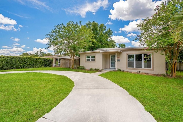 single story home featuring a front lawn