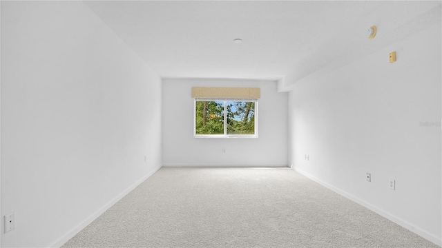 unfurnished room with carpet flooring