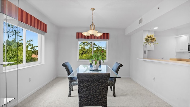 dining space with light carpet