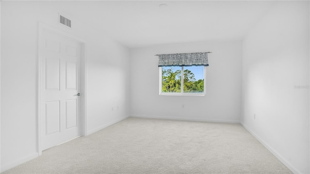 empty room featuring light colored carpet