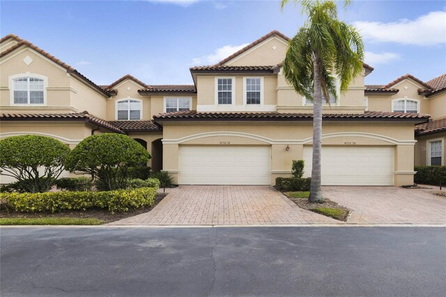 mediterranean / spanish house featuring a garage