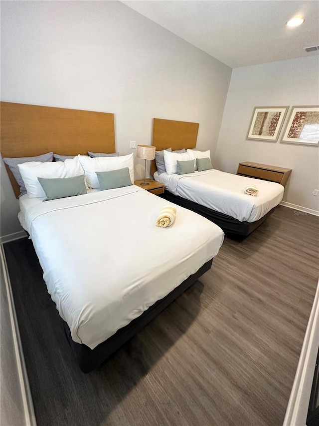 bedroom featuring dark wood-type flooring