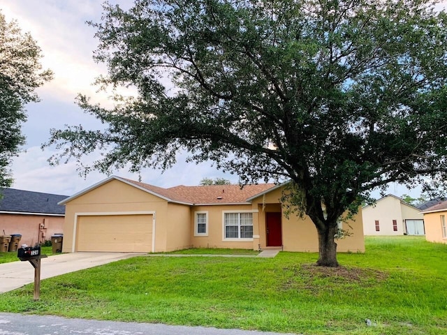 ranch-style house with a garage and a front yard