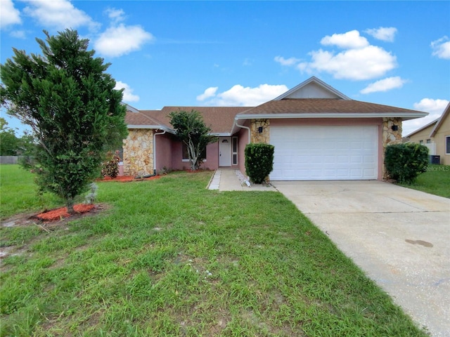 ranch-style home with a garage and a front yard