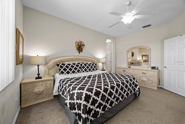 bedroom with ceiling fan and carpet floors