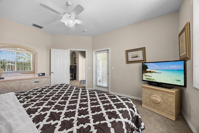 bedroom with multiple windows, carpet floors, and ceiling fan