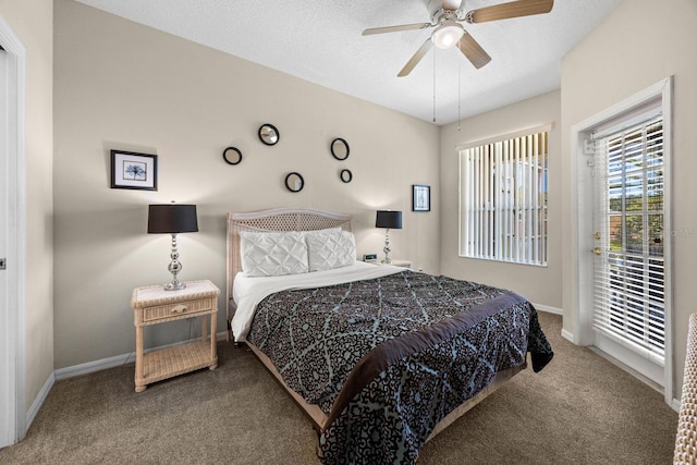 bedroom with carpet, ceiling fan, and a textured ceiling