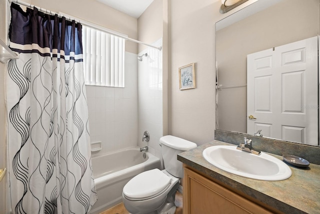 full bathroom with shower / bathtub combination with curtain, vanity, and toilet