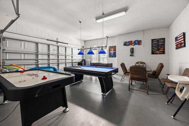 rec room featuring a textured ceiling and billiards