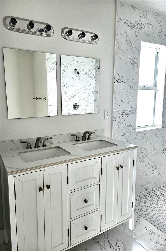 bathroom with vanity and a shower