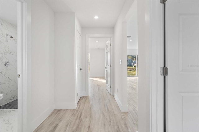 hallway with light wood-type flooring