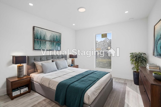 bedroom with light hardwood / wood-style floors