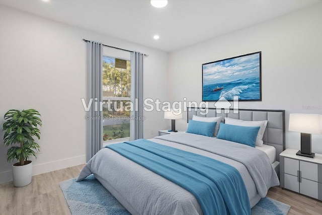 bedroom with light hardwood / wood-style floors