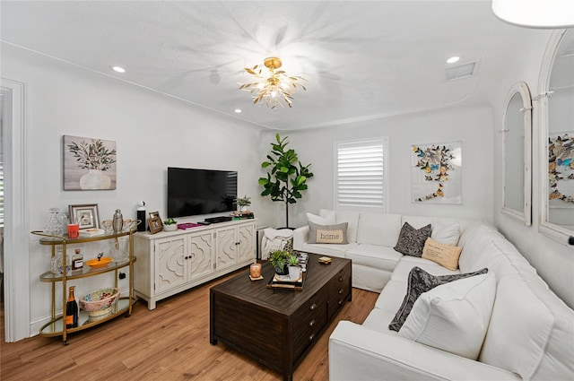 living room with light hardwood / wood-style flooring