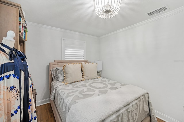 bedroom with crown molding and dark wood-type flooring