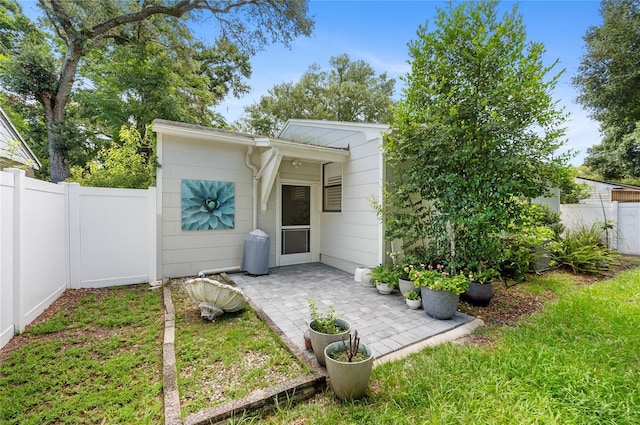 back of property featuring a patio