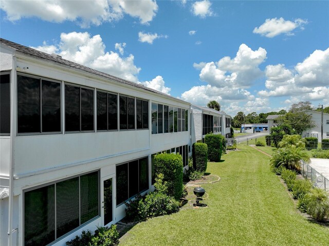 view of yard with a sunroom