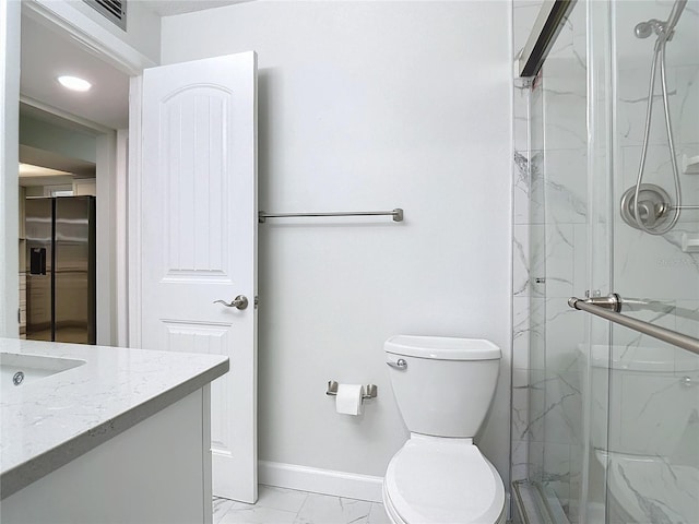 bathroom with vanity, an enclosed shower, tile patterned flooring, and toilet