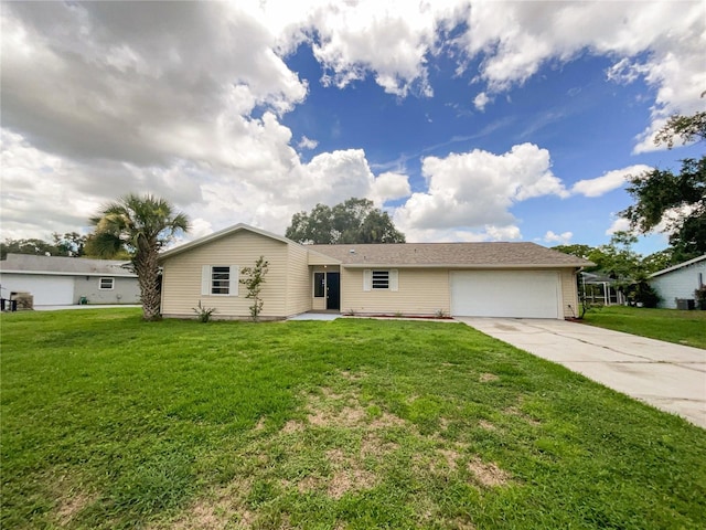 ranch-style house with a garage and a front lawn