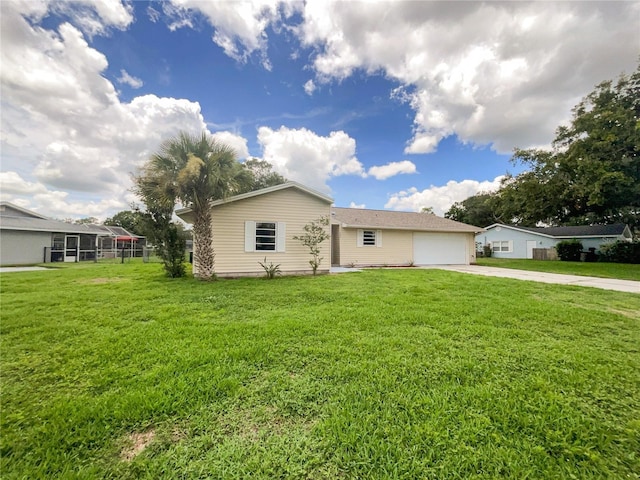 exterior space featuring a garage and a front lawn