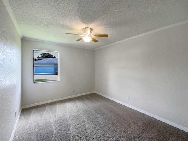 carpeted empty room featuring ceiling fan, ornamental molding, and a textured ceiling