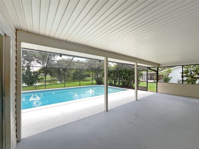 view of pool featuring a patio, a lanai, and a yard