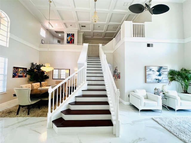 9060 Heritage Bay Cir, Orlando, FL 32836 - stairway featuring marble finish floor, baseboards, and coffered ceiling