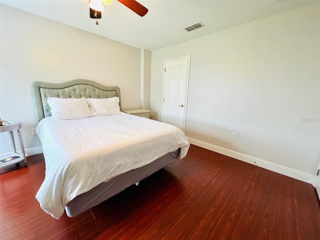 9060 Heritage Bay Cir, Orlando, FL 32836 - bedroom featuring baseboards, visible vents, ceiling fan, and wood finished floors