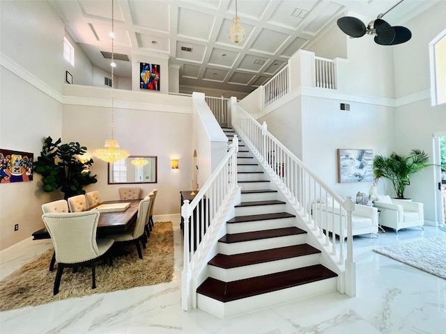 9060 Heritage Bay Cir, Orlando, FL 32836 - stairway with an inviting chandelier, marble finish floor, a towering ceiling, and coffered ceiling