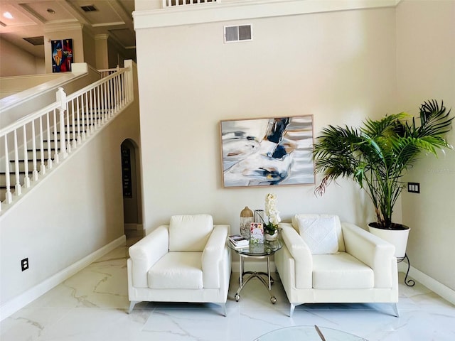 9060 Heritage Bay Cir, Orlando, FL 32836 - living area with marble finish floor, arched walkways, baseboards, and visible vents