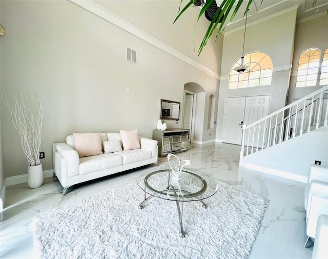 9060 Heritage Bay Cir, Orlando, FL 32836 - living area featuring marble finish floor, visible vents, arched walkways, and ornamental molding