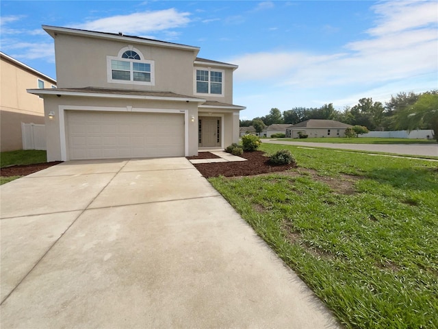 front facade with a front yard and a garage