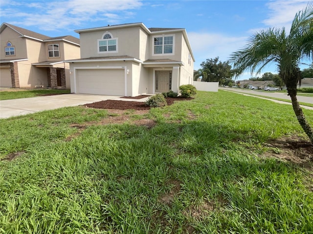 view of front of property featuring a garage and a front lawn