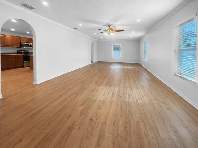 unfurnished living room featuring ceiling fan, crown molding, and light wood-type flooring