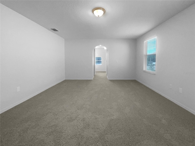 spare room featuring carpet floors