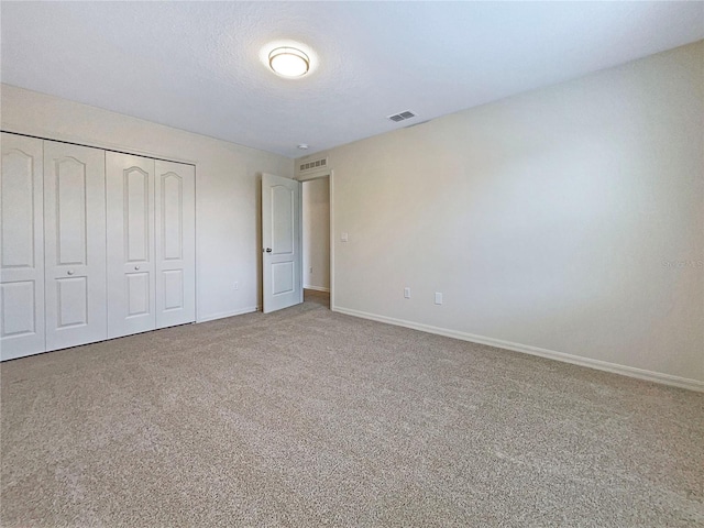3444 97th Ln E, Palmetto, FL 34221 - unfurnished bedroom featuring carpet floors and a closet