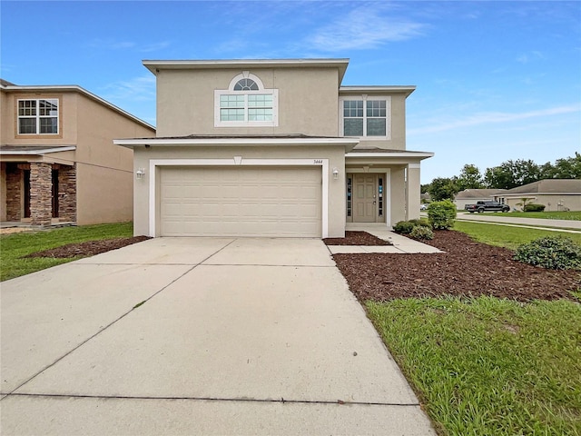 3444 97th Ln E, Palmetto, FL 34221 - traditional-style house featuring a garage, concrete driveway, and stucco siding