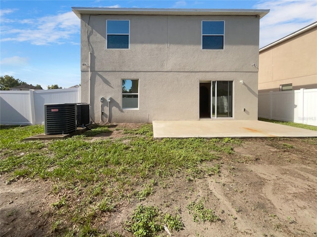 3444 97th Ln E, Palmetto, FL 34221 - rear view of house with a patio and stucco siding
