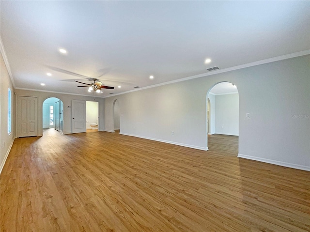 3444 97th Ln E, Palmetto, FL 34221 - spare room featuring arched walkways, ceiling fan, crown molding, recessed lighting, and light wood-style flooring
