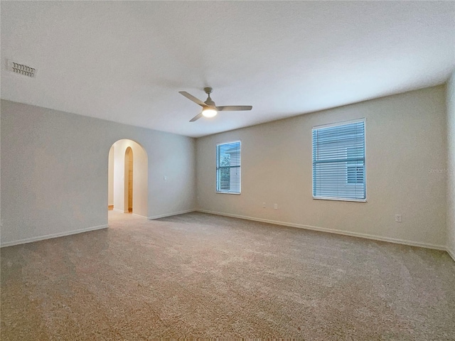 3444 97th Ln E, Palmetto, FL 34221 - carpeted spare room with arched walkways and ceiling fan