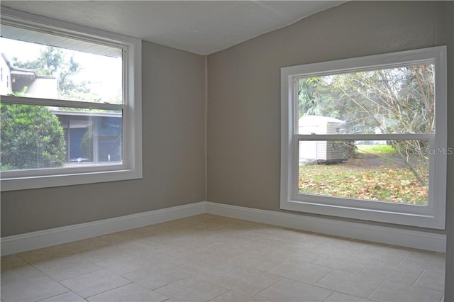 unfurnished room with light tile patterned floors