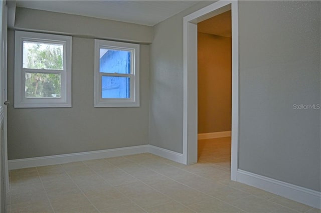 spare room with light tile patterned flooring